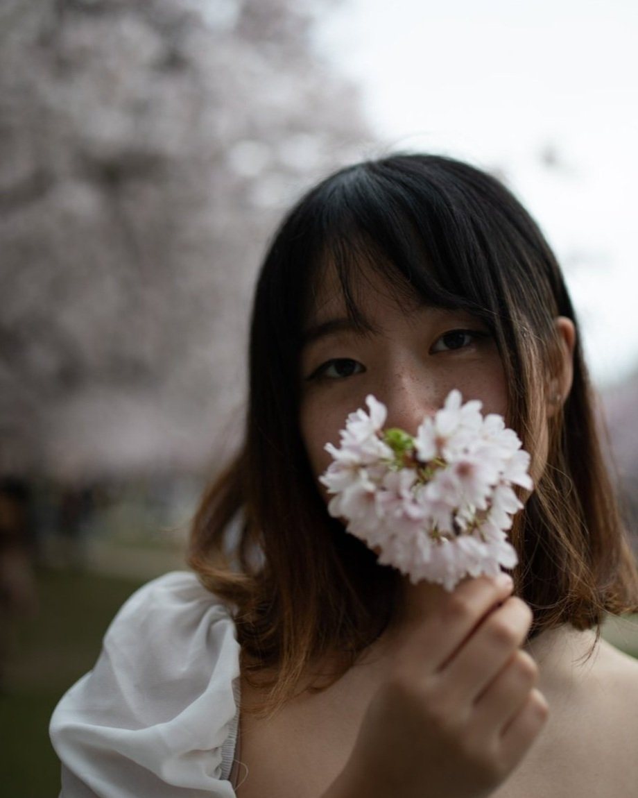 Lulu Wang with cherry blossoms
